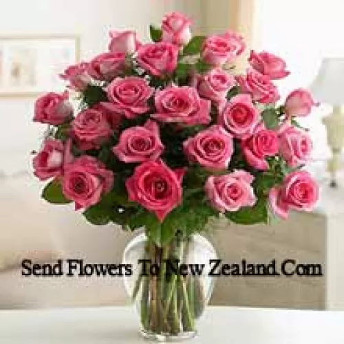 37 Pink Roses With Some Ferns In A Glass Vase