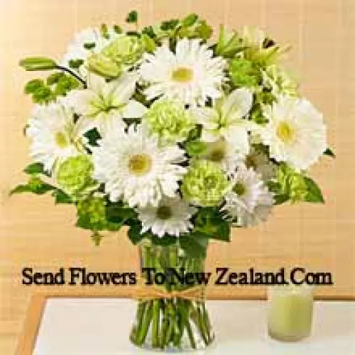White Gerberas, White Alstroemeria And Other Assorted Seasonal Flowers Arranged Beautifully In A Glass Vase
